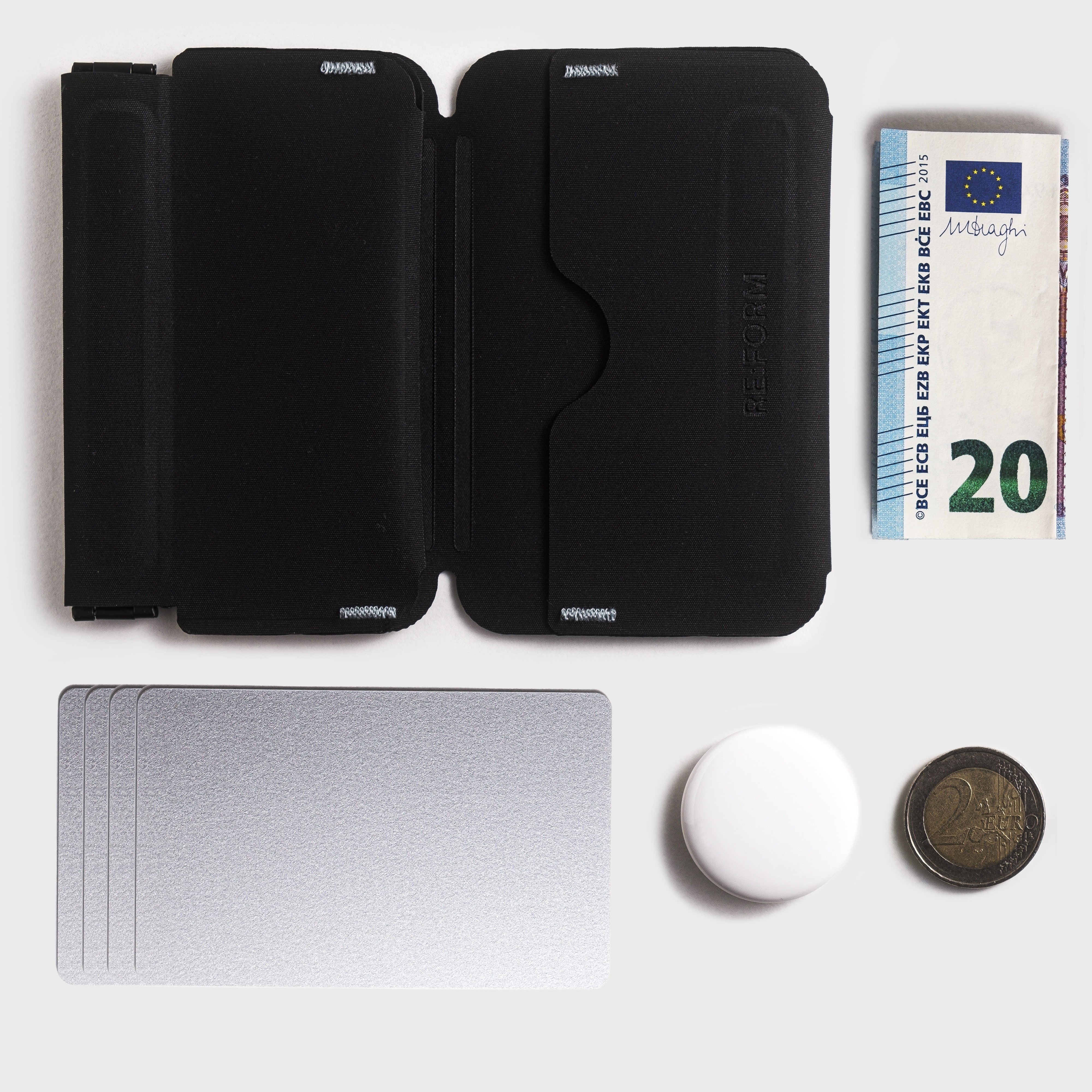 Coins, Cards, Cash and Apple AirTag fit into the RE:FORM RE:01 Coin Sleeve Wallet